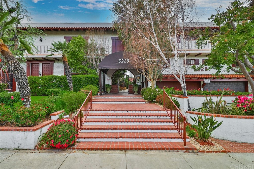 5229 Balboa Boulevard, Unit 35 Encino, CA 91316 - Photo 1 of 44 a front view of a house with a yard and potted plants