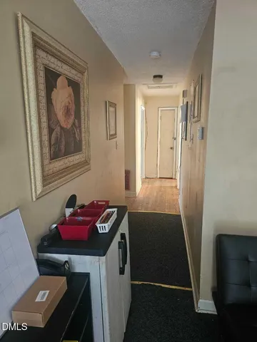 a view of workspace and chair with wooden floor