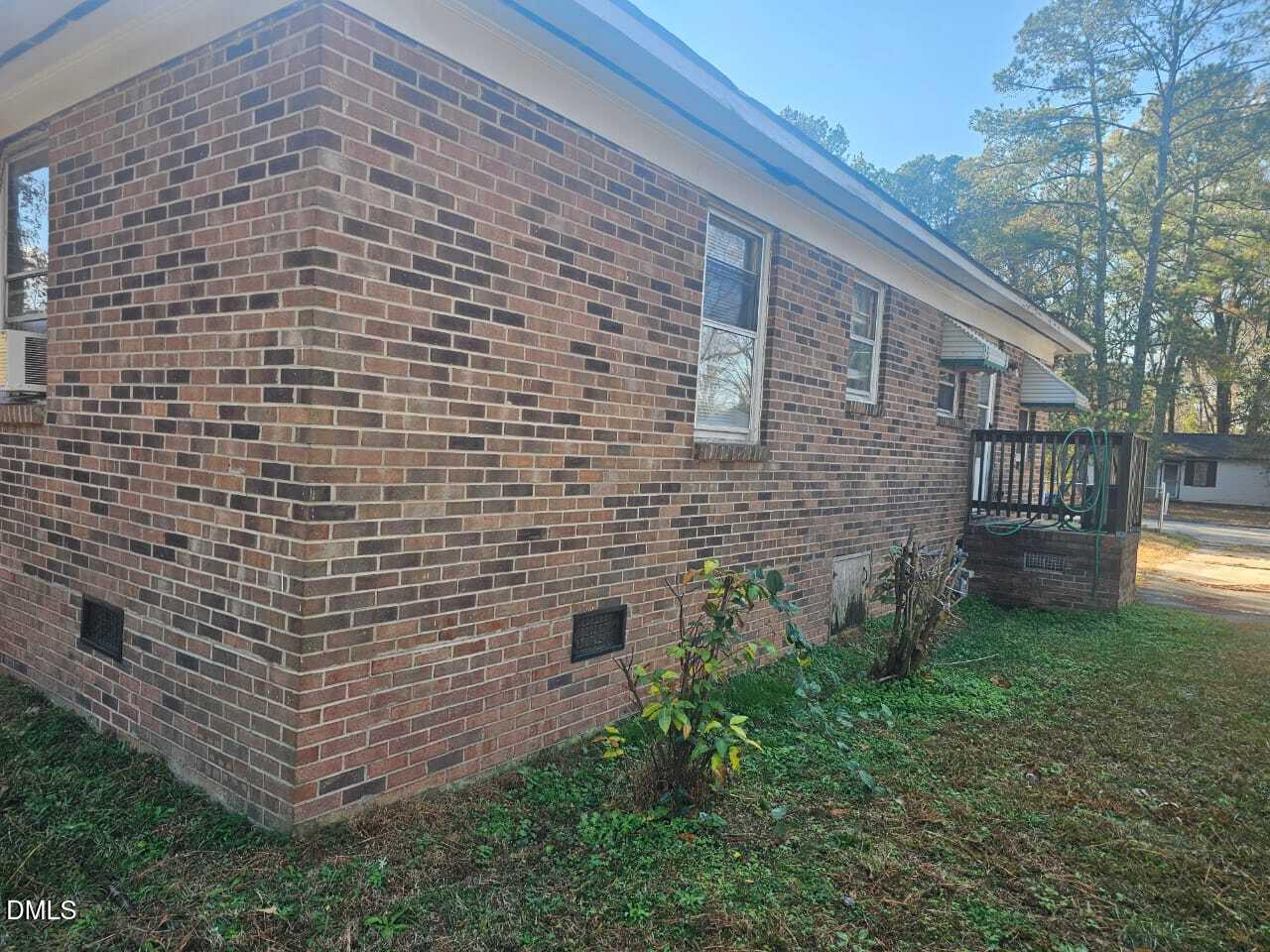 1649 Harper Street Rocky Mount, NC 27801 - Photo 31 of 34 a brick building with a yard