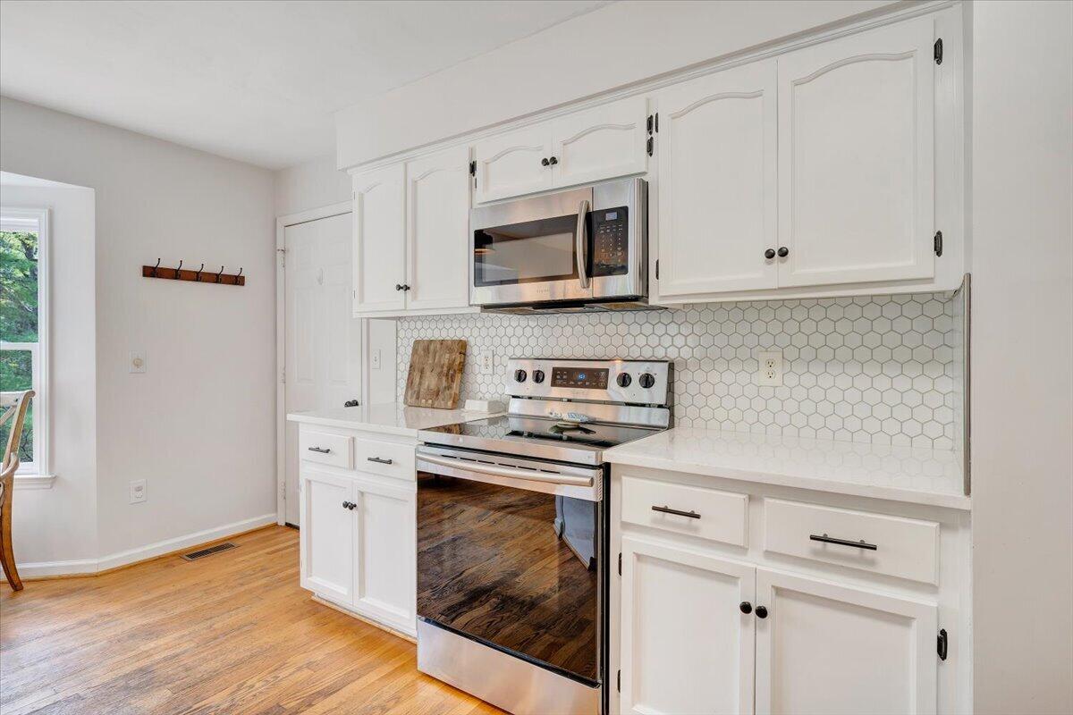 245 Timber Trail Lane Hardy, VA 24101 - Photo 16 of 38 a kitchen with stainless steel appliances white cabinets and a refrigerator
