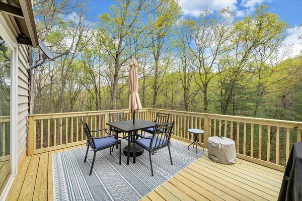 a view of a deck patio and outdoor seating