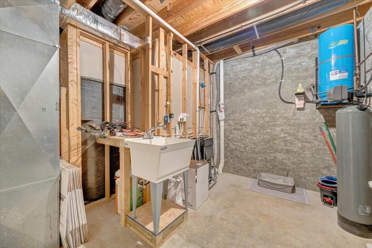 245 Timber Trail Lane Hardy, VA 24101 - Photo 31 of 38 a bathroom with a double vanity sink a toilet and a shower
