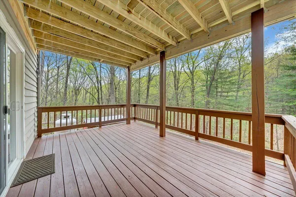 a view of porch with wooden floor