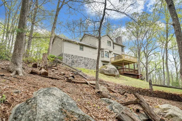 a view of a backyard with wooden fence