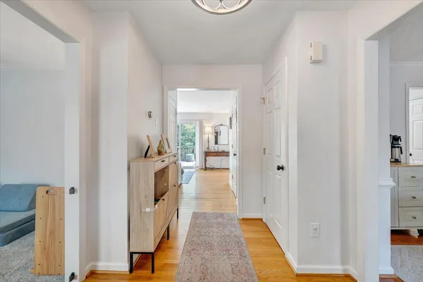 a view of a hallway with a white walls