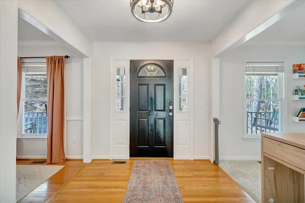 a view of a hallway with front door