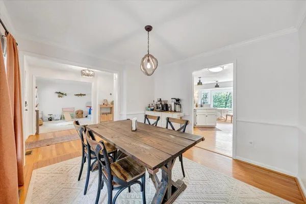 a view of a dining room with furniture window and wooden floor