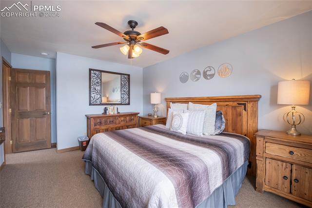 710 Gothic Road, Unit 1 Crested Butte, CO 81225 - Photo 17 of 25 Bedroom with light colored carpet and ceiling fan