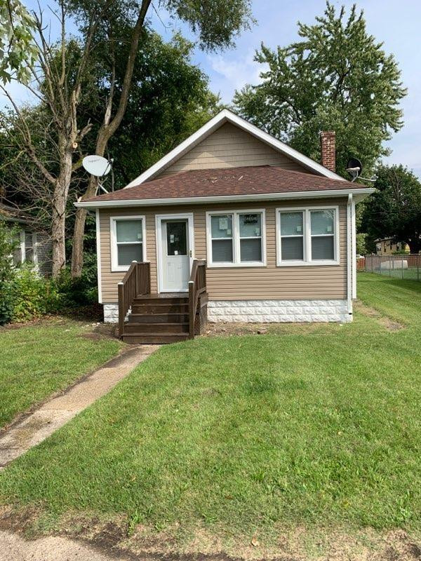 3863 Delaware Street Gary, IN 46409 - Photo 1 of 49 a front view of a house with a yard