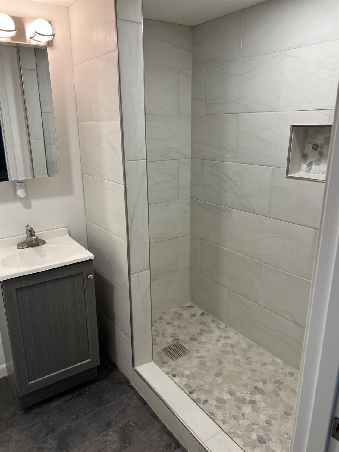 3863 Delaware Street Gary, IN 46409 - Photo 13 of 49 a bathroom with a sink and a mirror