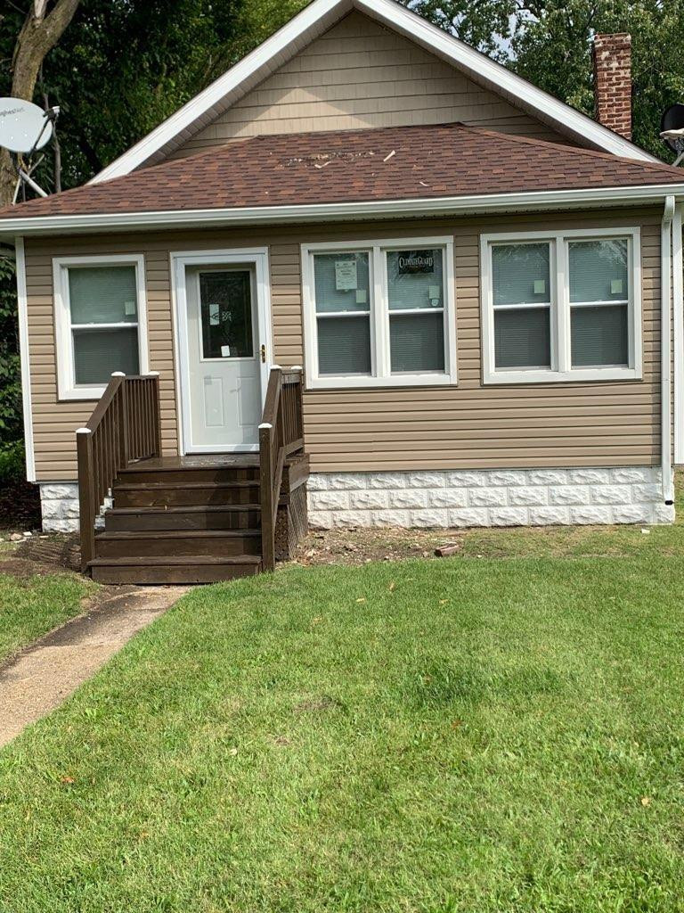 3863 Delaware Street Gary, IN 46409 - Photo 2 of 49 a front view of a house with garden