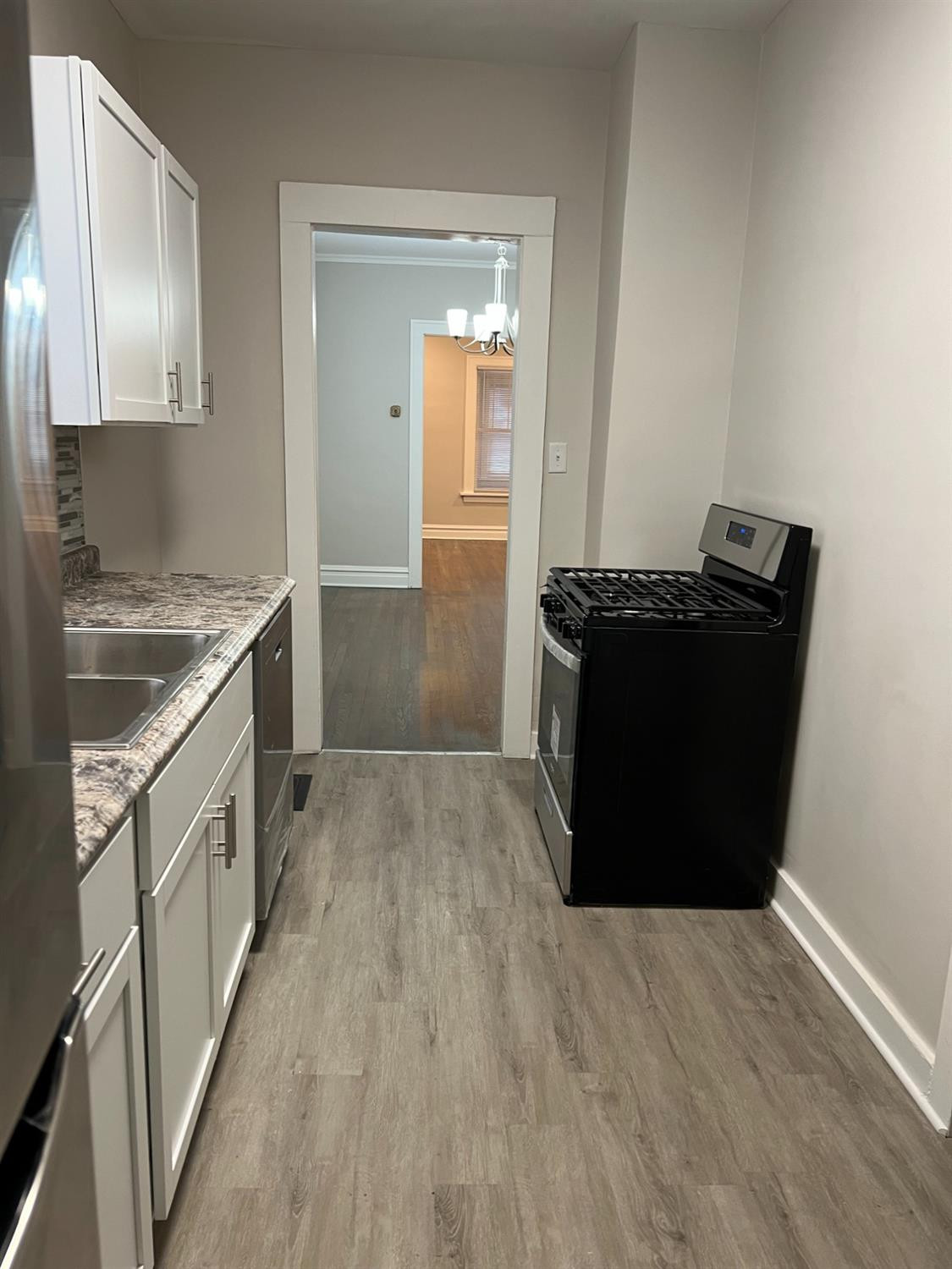 3863 Delaware Street Gary, IN 46409 - Photo 29 of 49 a kitchen with a refrigerator and a stove