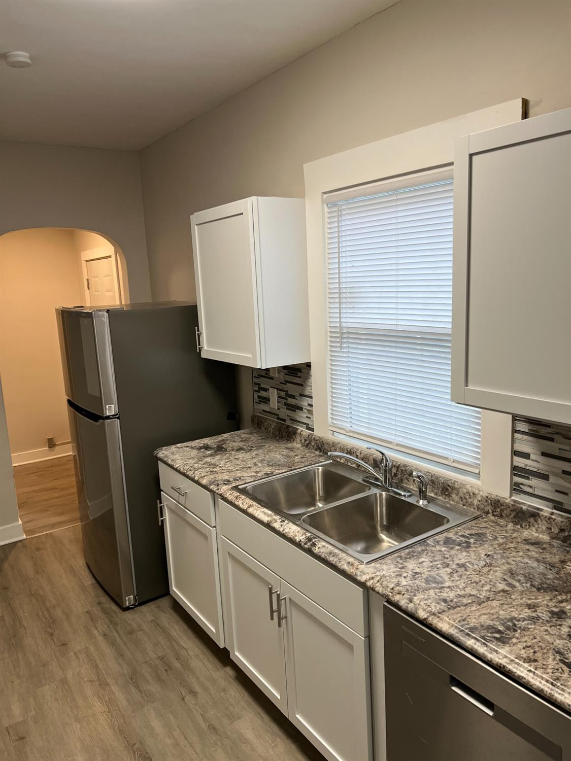 3863 Delaware Street Gary, IN 46409 - Photo 31 of 49 a kitchen with a sink and a refrigerator