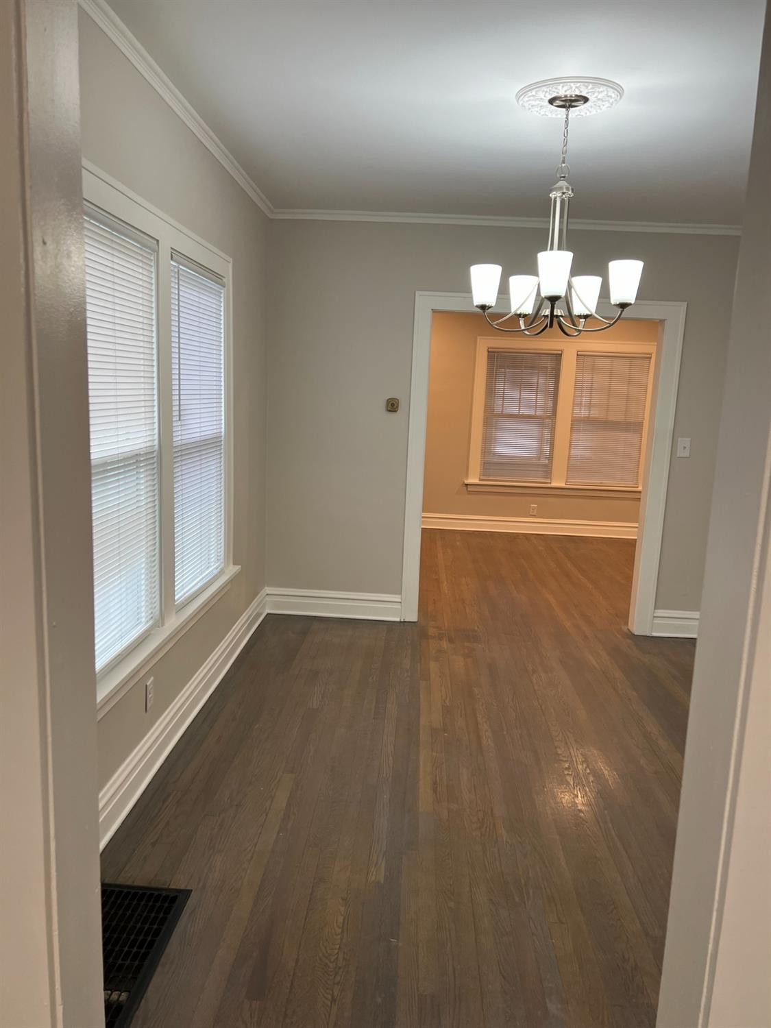 3863 Delaware Street Gary, IN 46409 - Photo 32 of 49 an empty room with wooden floor cabinet and windows