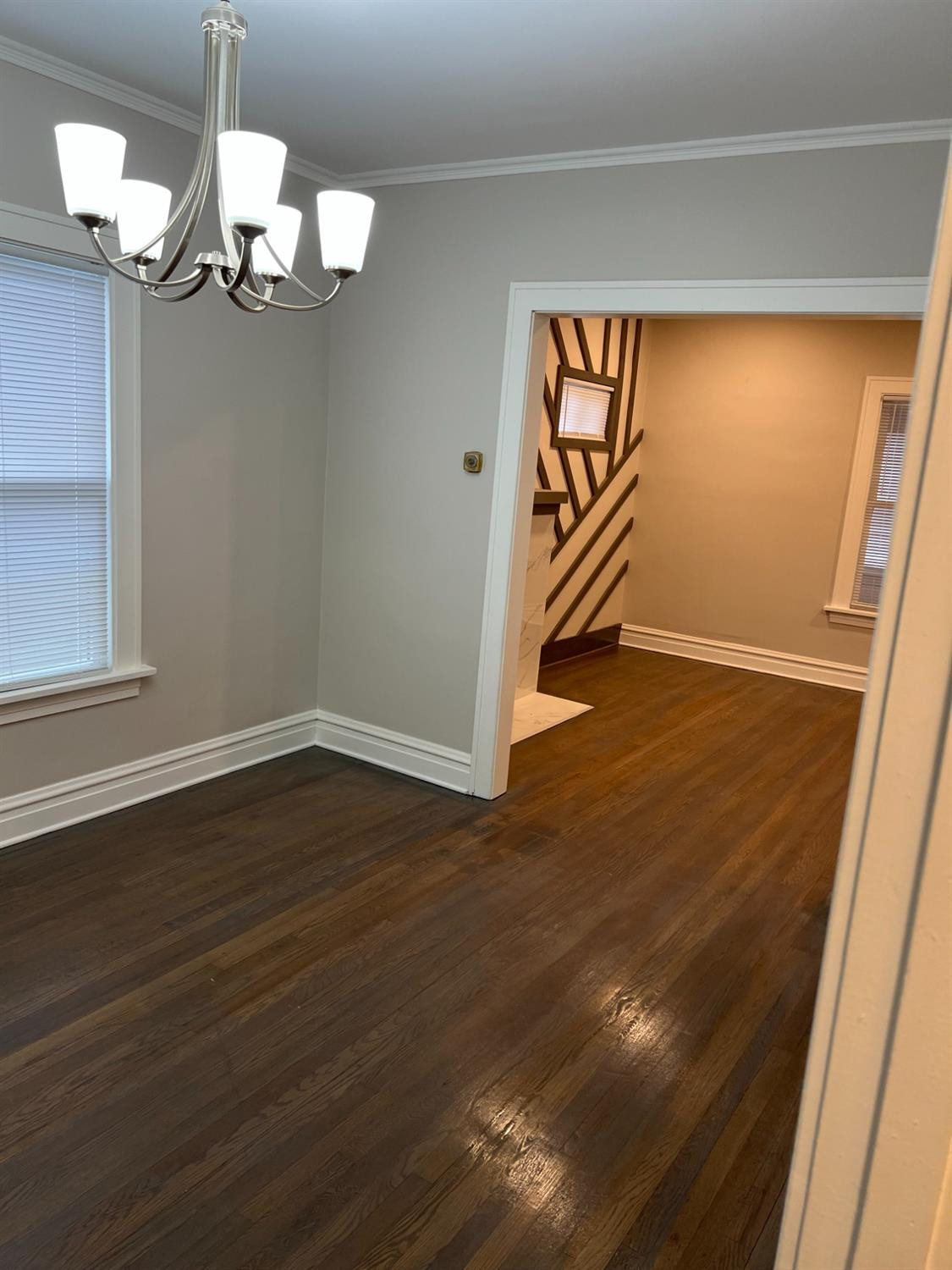 3863 Delaware Street Gary, IN 46409 - Photo 34 of 49 a view of an empty room with wooden floor and a window