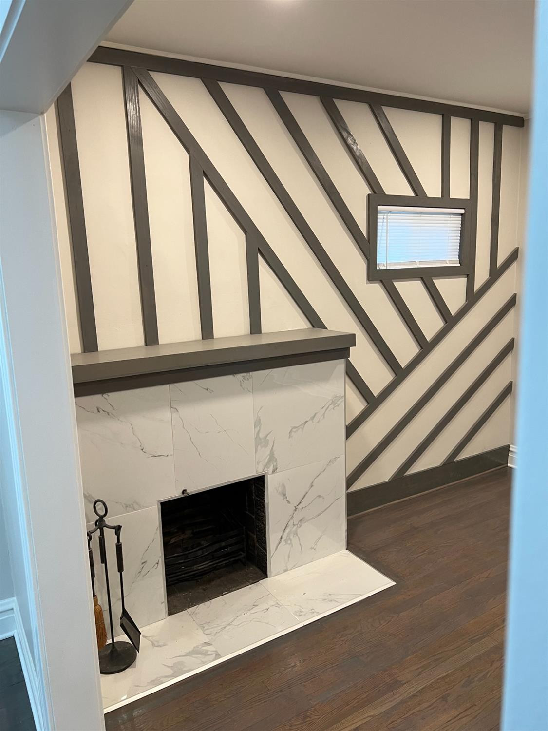 3863 Delaware Street Gary, IN 46409 - Photo 35 of 49 a living room with a fireplace and a large window