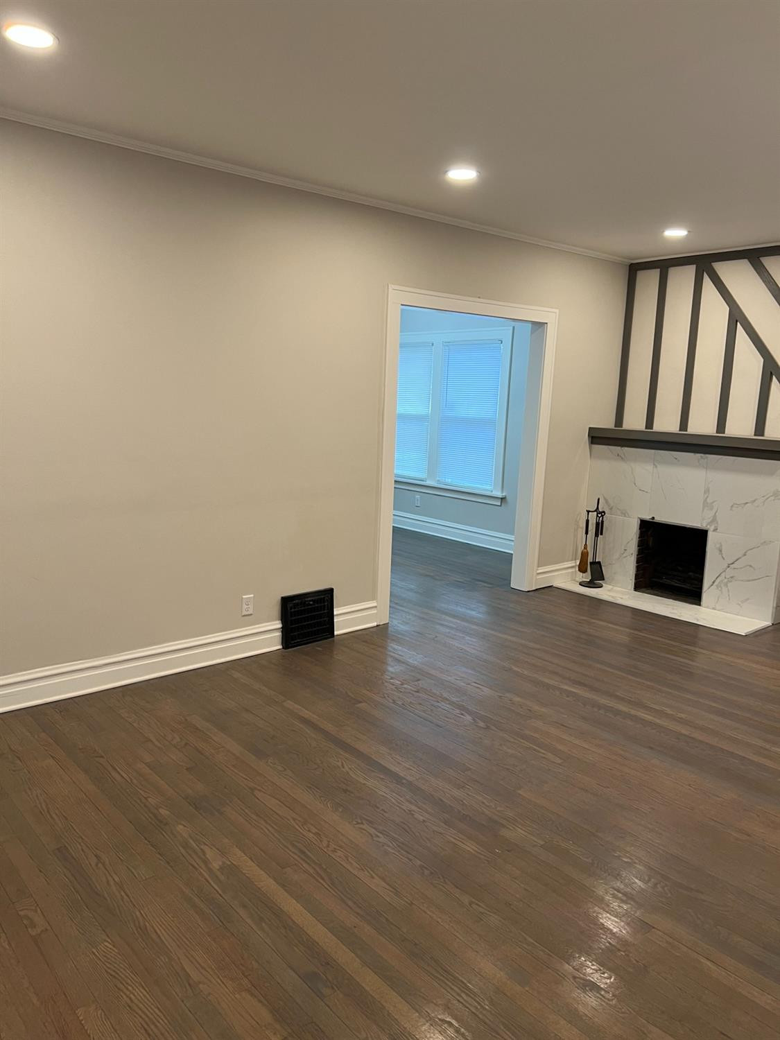 3863 Delaware Street Gary, IN 46409 - Photo 41 of 49 a view of an empty room with wooden floor and a window
