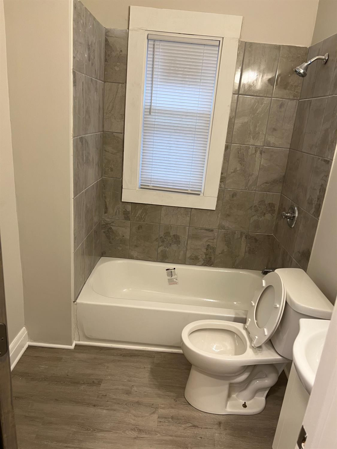 3863 Delaware Street Gary, IN 46409 - Photo 43 of 49 a bathroom with a toilet and a bathtub