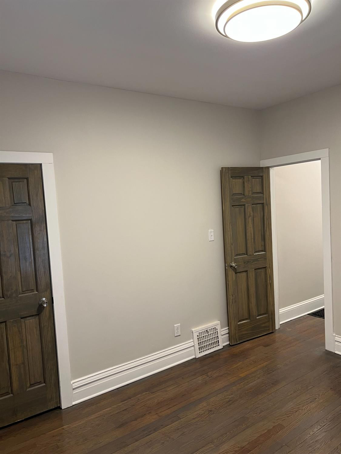 3863 Delaware Street Gary, IN 46409 - Photo 46 of 49 an empty room with wooden floor and mirror