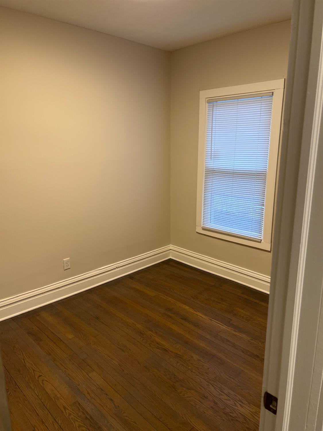 3863 Delaware Street Gary, IN 46409 - Photo 47 of 49 a view of an empty room with wooden floor and a window