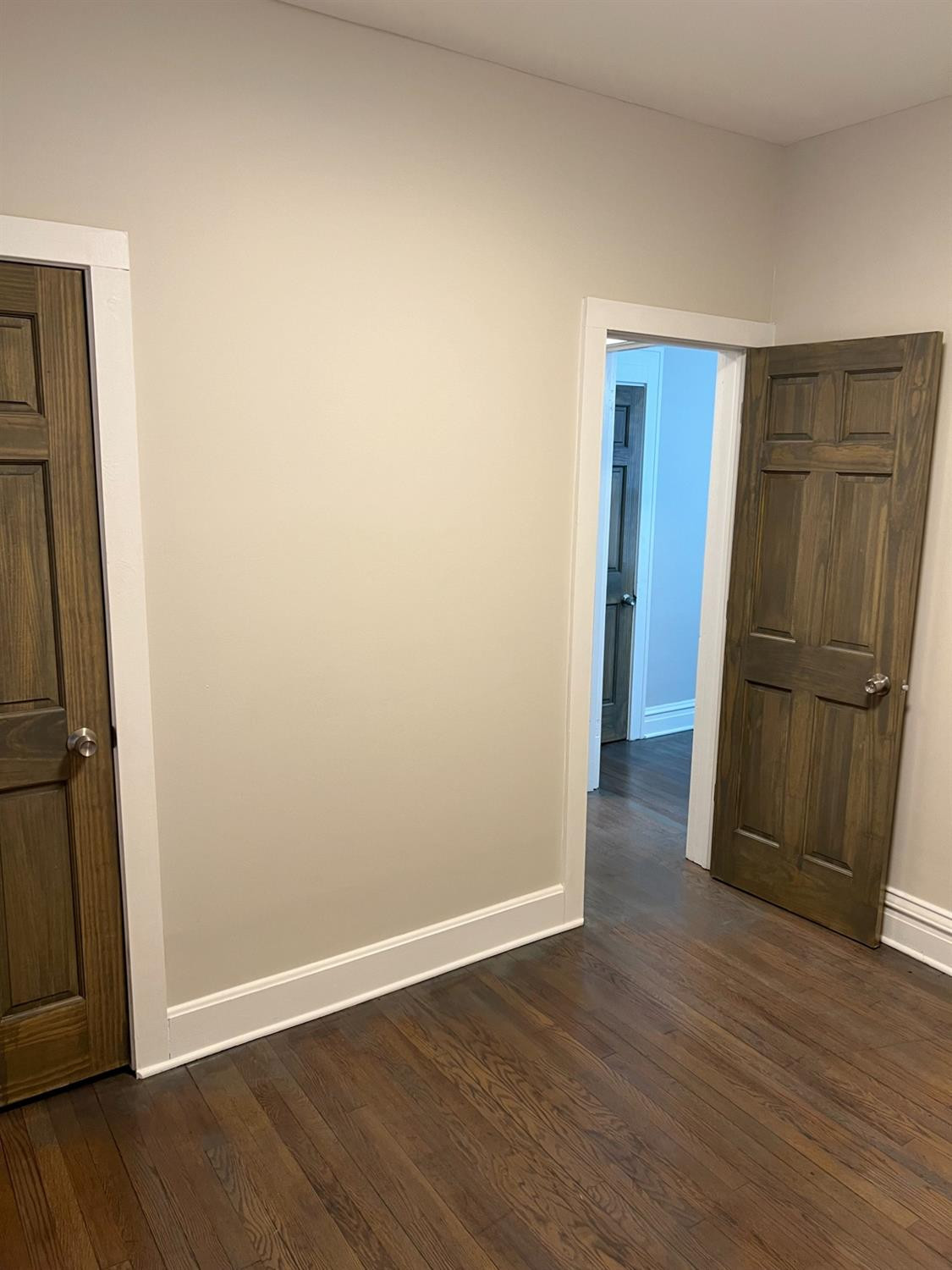 3863 Delaware Street Gary, IN 46409 - Photo 48 of 49 an empty room with wooden floor and a cabinet