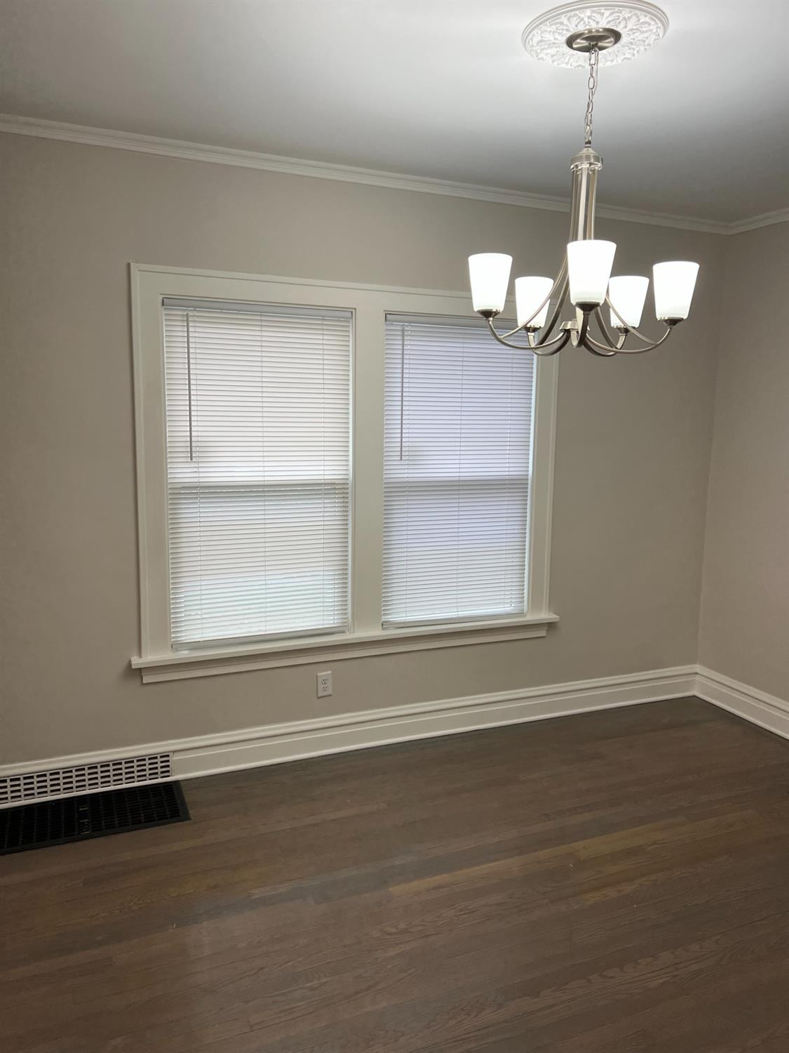 3863 Delaware Street Gary, IN 46409 - Photo 49 of 49 a view of a chandelier fan and wooden floor
