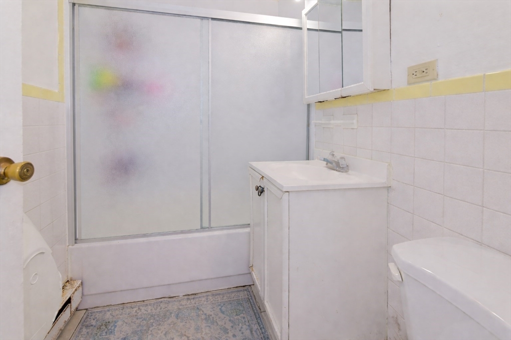 2 Universal Street, Unit 4 Framingham, MA 01702 - Photo 11 of 18 a bathroom with a sink a toilet and shower