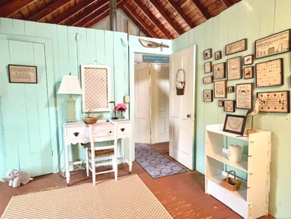 a bedroom with a bed and a table
