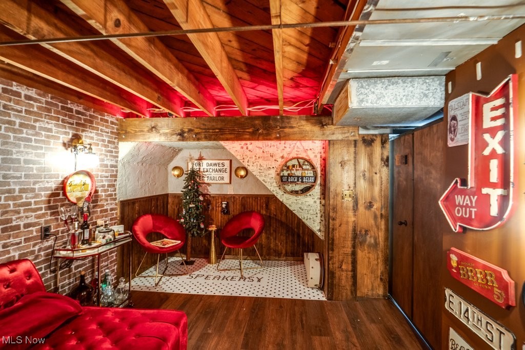 5284 Bridgewater Road Cleveland, OH 44124 - Photo 14 of 22 Speakeasy Room with brick wall and wood-type flooring