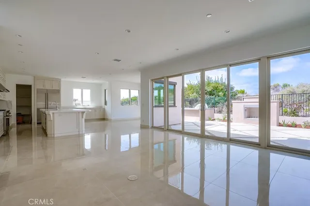 a view of a living room and a large window