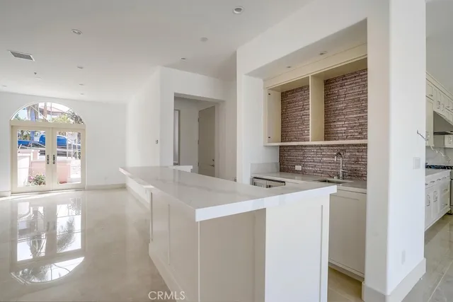 a kitchen with a sink cabinets and window