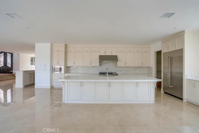 a bathroom with a double vanity sink mirror and a bathtub