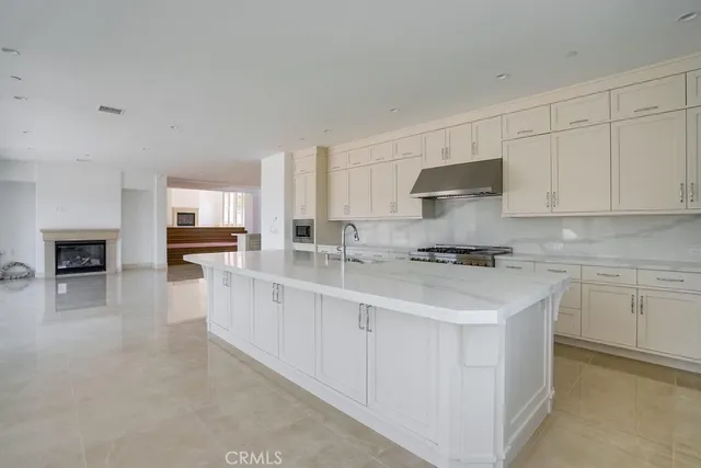 a kitchen with stainless steel appliances granite countertop a sink and cabinets