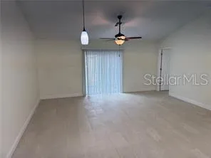 a view of an empty room with a window