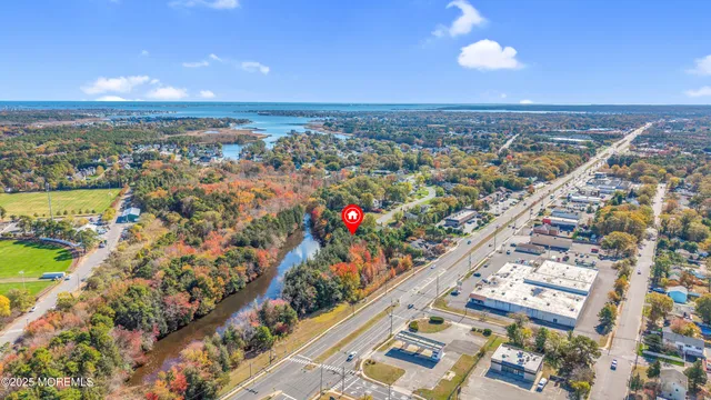 an aerial view of city and lake