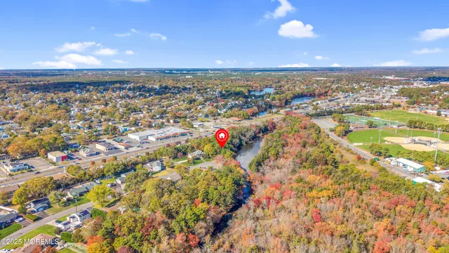 an aerial view of residential building and ocean