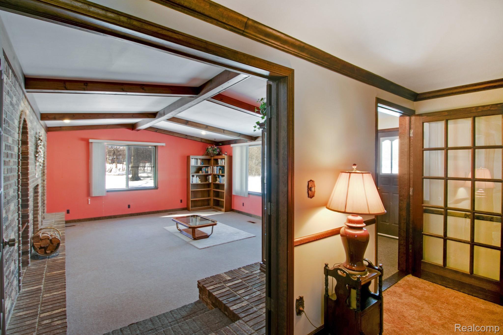 19754 Fry Road Northville, MI 48167 - Photo 8 of 35 Front door/foyer (right), living room/great room through French doors.
