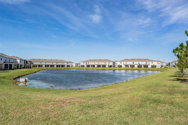 a front view of a house with sitting area