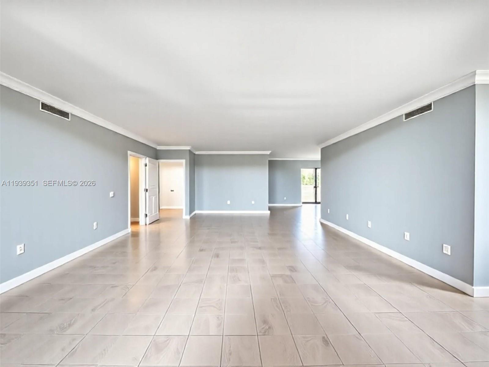 2000 Towerside Terrace, Unit 1806 Miami, FL 33138 - Photo 22 of 58 a view of an empty room with a window