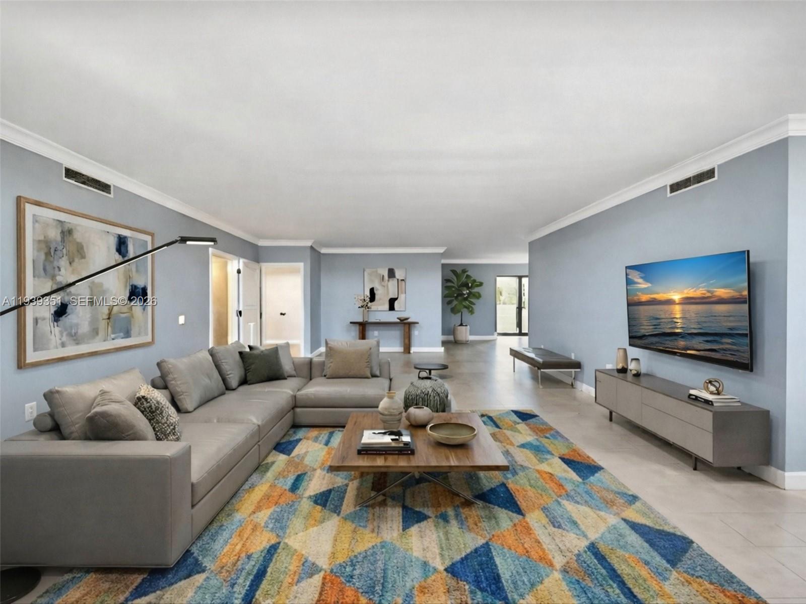 2000 Towerside Terrace, Unit 1806 Miami, FL 33138 - Photo 23 of 58 a living room with furniture and a flat screen tv