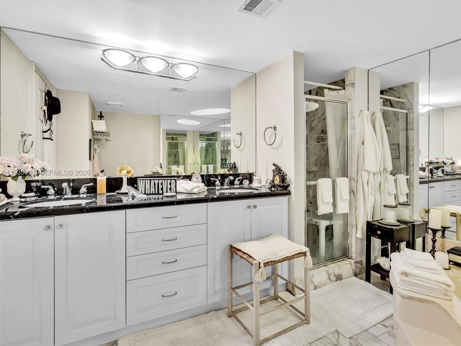 2000 Towerside Terrace, Unit 1806 Miami, FL 33138 - Photo 27 of 58 a bathroom with a sink and a mirror