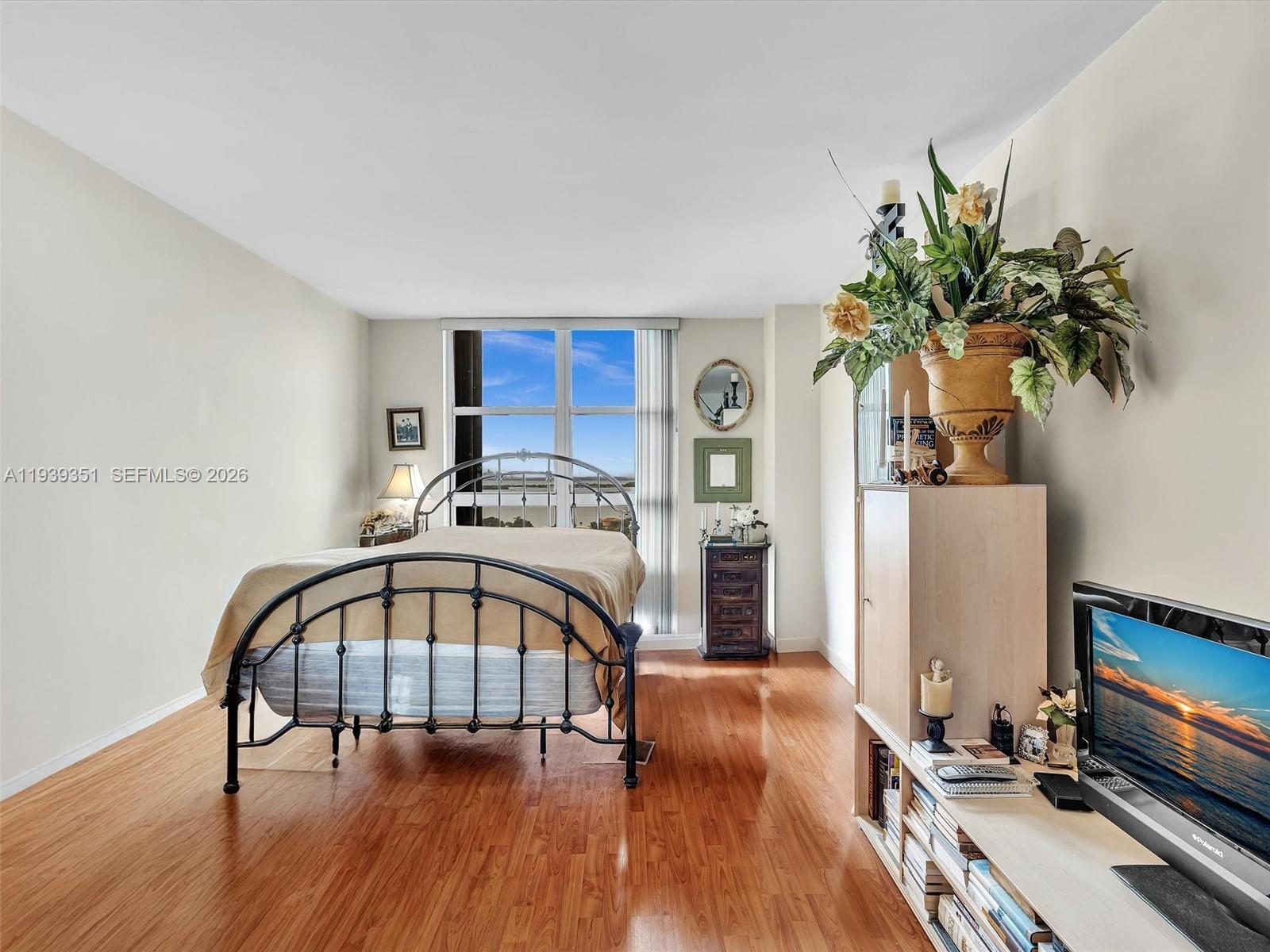 2000 Towerside Terrace, Unit 1806 Miami, FL 33138 - Photo 44 of 58 a living room with furniture and a potted plant
