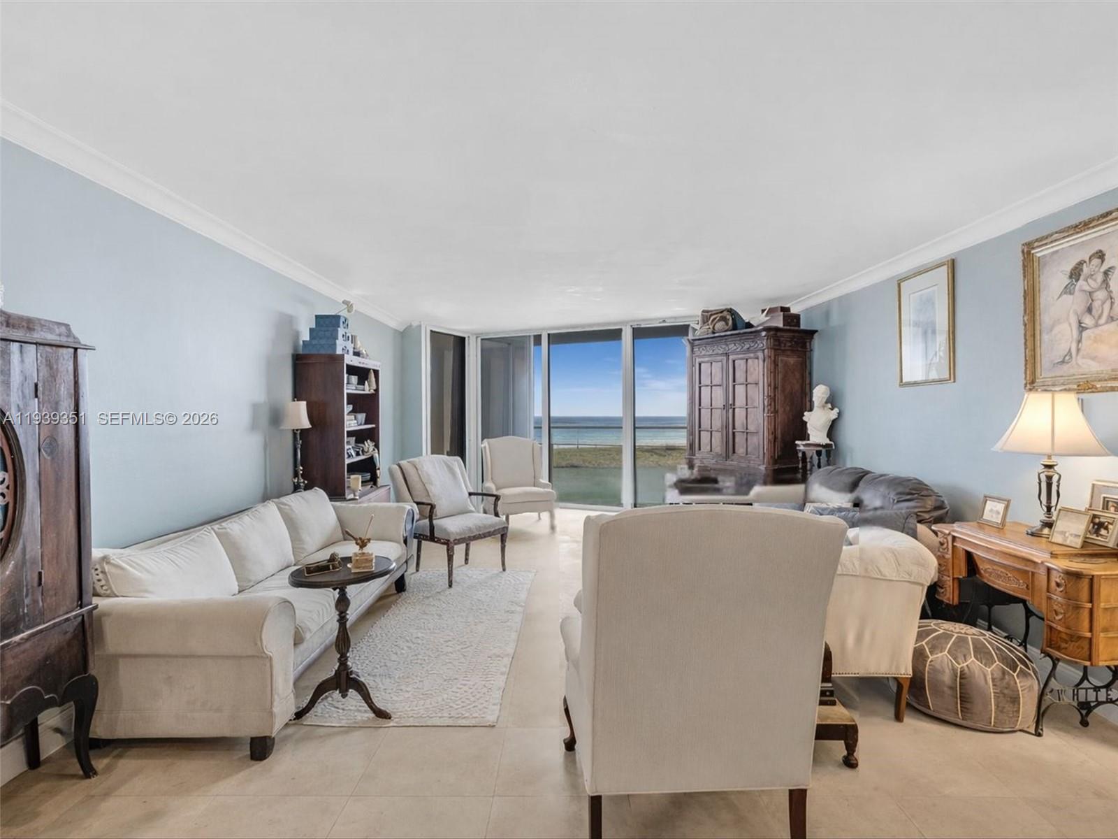 2000 Towerside Terrace, Unit 1806 Miami, FL 33138 - Photo 5 of 58 a living room with furniture and a large window