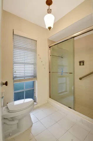 a view of a chair and table under an umbrella