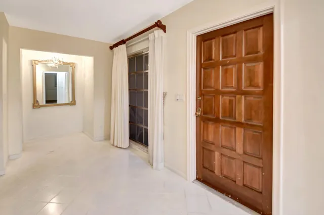 a view of a big room with a large mirror