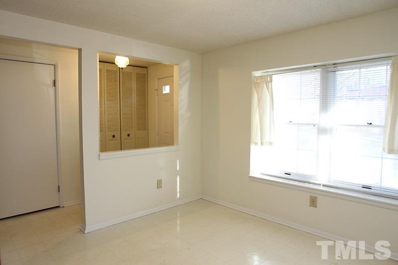 7725 Sandra Lane Raleigh, NC 27615 - Photo 3 of 12 a bathroom with a window and a shower