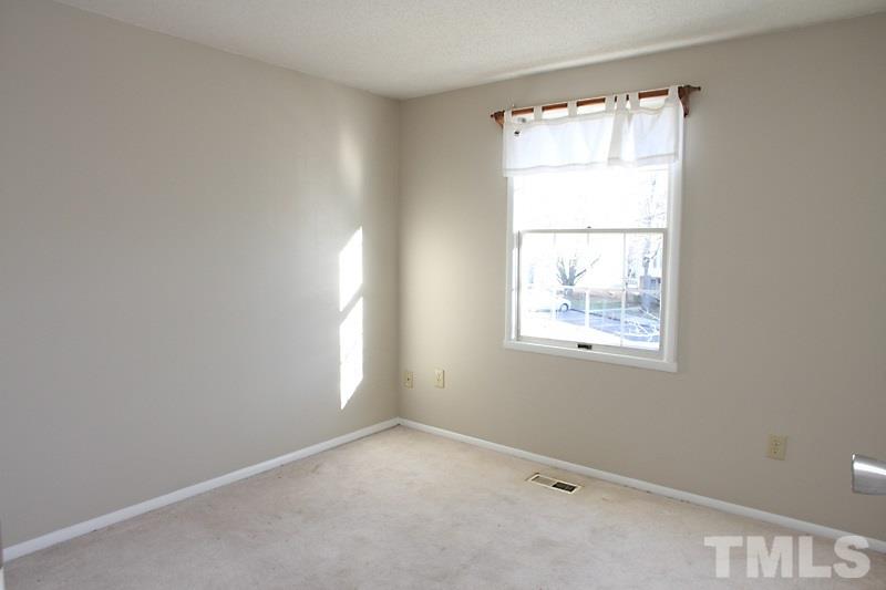 7725 Sandra Lane Raleigh, NC 27615 - Photo 8 of 12 a view of an empty room with a window