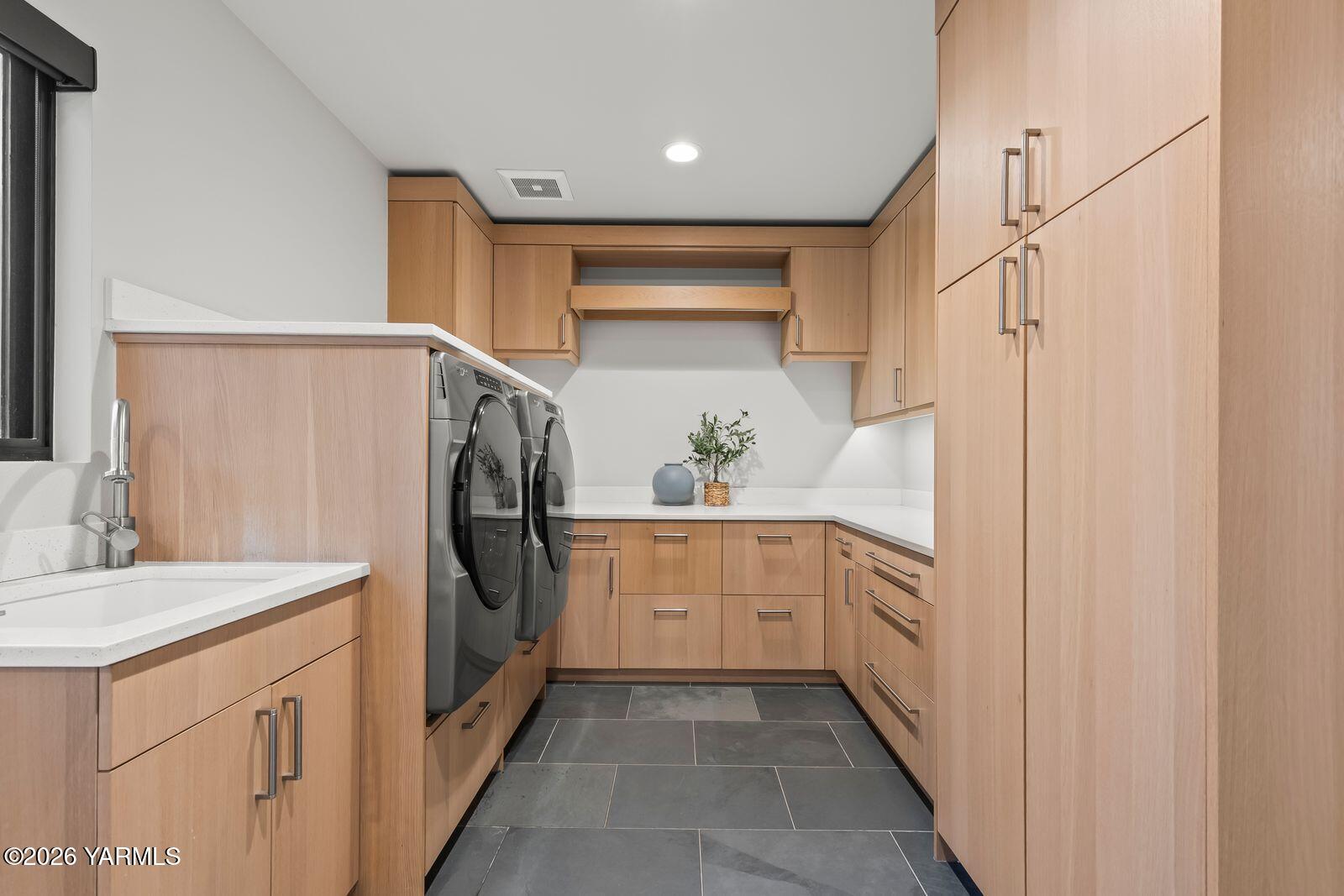 13990 Marble Road Yakima, WA 98908 - Photo 48 of 60 a kitchen with white cabinets and refrigerator