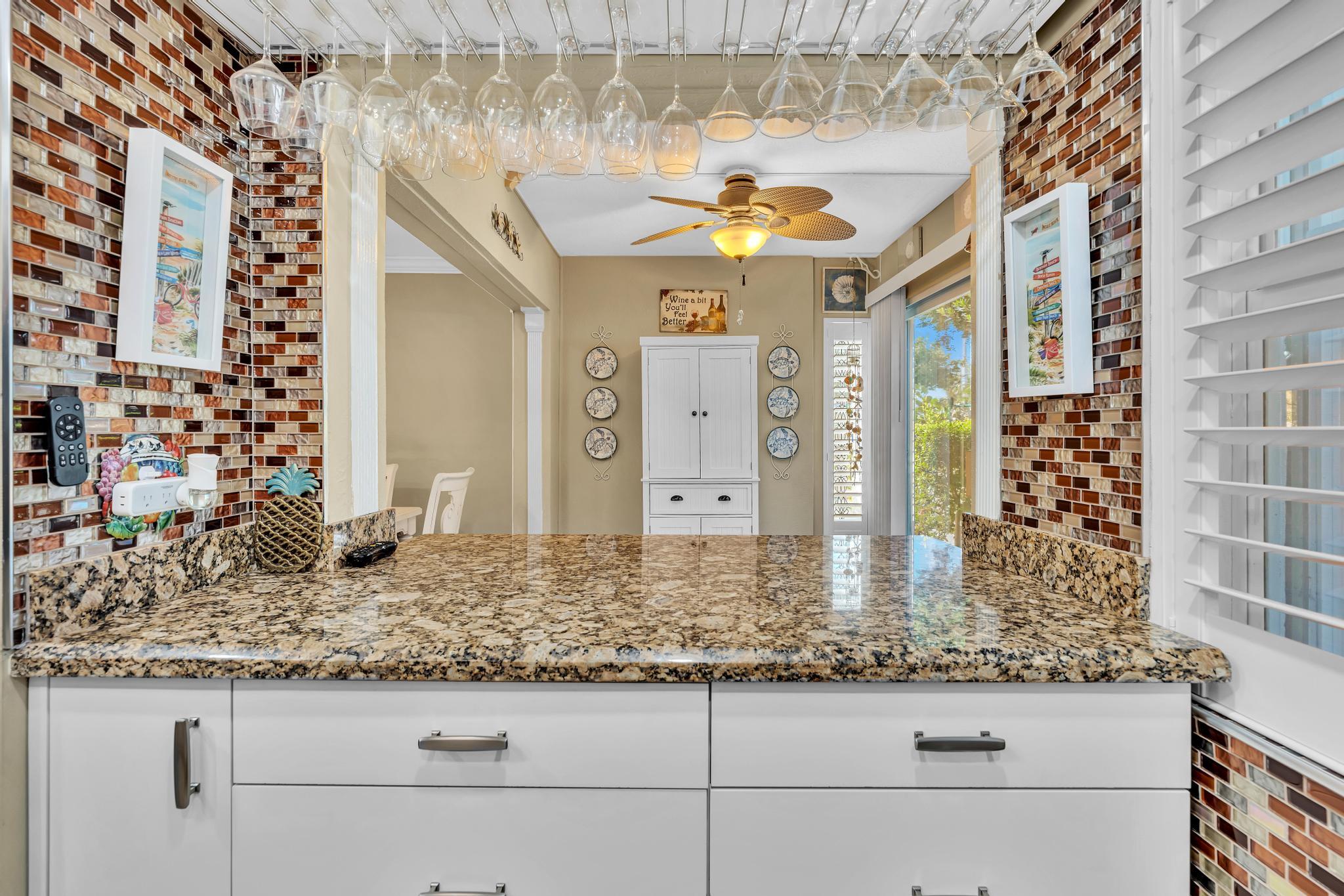 34 Colonial Club Drive, Unit 101 Boynton Beach, FL 33435 - Photo 16 of 58 a bathroom with a granite countertop sink and a mirror