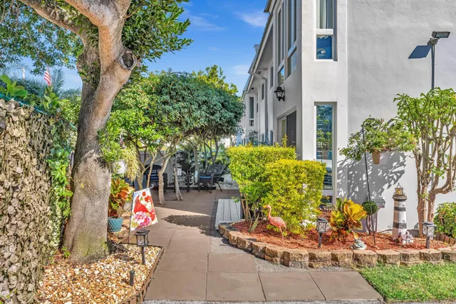 a kitchen with granite countertop a stove a sink and a microwave